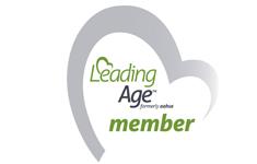 a leading age member logo with a heart in the middle
